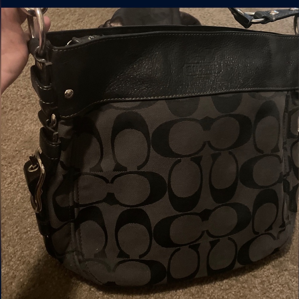 Black Coach purse . In great condition. Dust bag included .